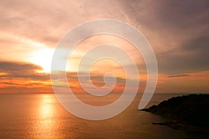 Beautiful Tropical Sunset Scene in the Sea. Phuket Lam Phromthep. Sun and Cloud Background.