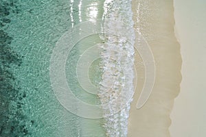 Beautiful tropical white empty beach and sea waves seen from above. Seychelles beach aerial view photo