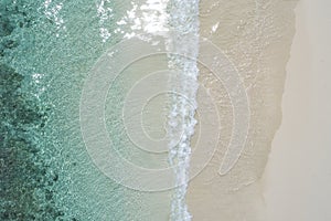 Beautiful tropical white empty beach and sea waves seen from above. Seychelles beach aerial view