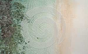 Beautiful tropical white empty beach and sea waves seen from above. Seychelles beach aerial view