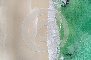 Beautiful tropical white empty beach and sea waves seen from above. Seychelles beach aerial view