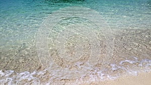 Beautiful tropical white sand beach and splashing wave of crystal clear green turquoise sea water for background,Krabi,Andaman sea