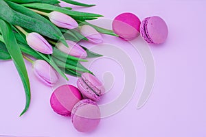 Beautiful tulips with colourful biscuits macaroon