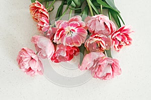 Beautiful tulips flat lay on grey stone background, space for text. . Happy Valentines day and happy mother