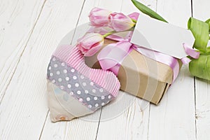 Beautiful tulips with gift box. happy mothers day, romantic still life, fresh flowers.