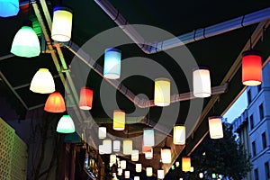 Beautiful turkish light bulbs lamps on Istanbul bazaar. Multi colored light lampions hanging