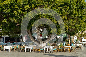 beautiful Turkish style restaurant with white tables and colorful decorations in Kas city