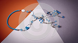 Beautiful Turquoise Chain Necklace on Orange Gray Background