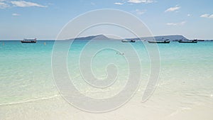 Beautiful turquoise colored ocean water at White Beach in Koh Rong Sanloem Island in Sihanoukville, Cambodia.