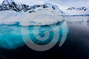 Beautiful turquoise ice below surface glacier in Antarctica