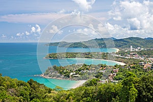 Beautiful turquoise ocean waves with boats and coastline from high view point. Kata and Karon beaches