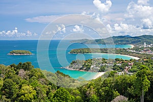 Beautiful turquoise ocean waves with boats and coastline from high view point. Kata and Karon beaches