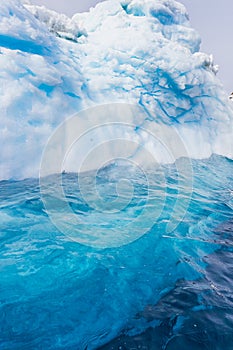 Beautiful turquoise water under iceberg in Antarctica