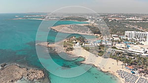 Beautiful turquoise waters and white sand beach of Ayia Nappa\'s Nissi beach - Cyprus Drone 4K