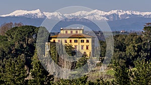 Beautiful Tuscan manor house with snowy mountains in the background, Pontedera, Pisa, Tuscany, Italy