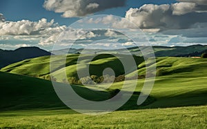 Beautiful Tuscany landscape with green meadows and blue sky