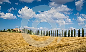 Beautiful Tuscany landscape with traditional farm house and dram