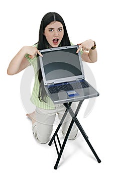 Beautiful Tween Girl Pointing To Laptop Screen