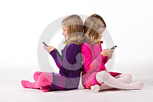 Beautiful twin girls text messaging