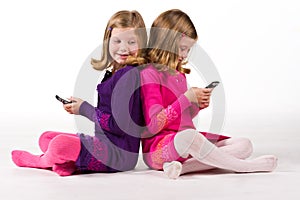 Beautiful twin girls text messaging