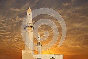 Beautiful twin minarets at sunset, khamis mosque