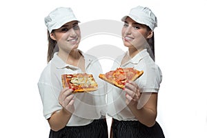 Beautiful twin sisters with pizza on white background