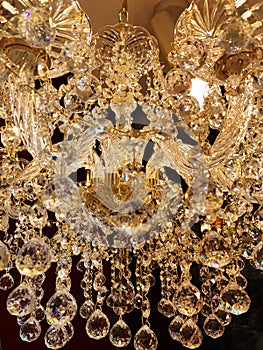 Beautiful twinkle crystal chandelier close up, warm light