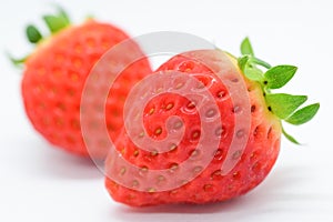 beautiful two fresh red strawberry isolated on white background