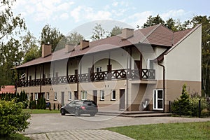 Beautiful two storey beach house and green trees outdoors