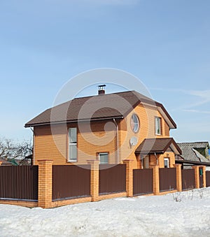 Two-storeyed brick cottage in early spring