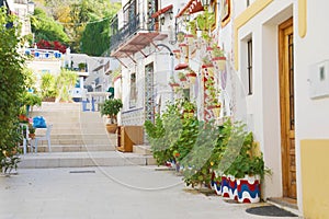 Beautiful typical alley of Barrio Santa Cruz in Alicante, Costa Blanca, Spain photo