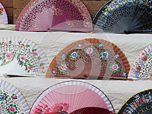 Beautiful typical fans to cool the air and the summer heat photo