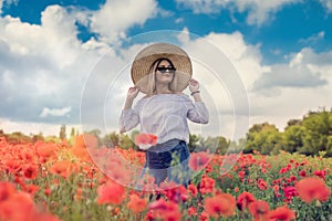 Beautiful ukrainian lady alone at flowers poppies field  sunny day