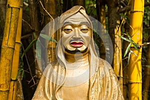 Beautiful unique buddha statue close shot, looking at the camera