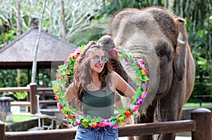 Beautiful unique elephant with girl at an elephants conservation reservation in Bali Indonesia