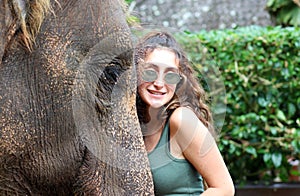 Beautiful unique elephant with girl at an elephants conservation reservation in Bali Indonesia