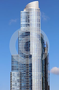 Beautiful unique skyscraper, modern building in the city of Chicago, Illinois. Blue glass architecture.