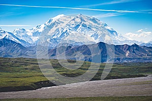 Beautiful unobstructed view of Mt Denali McKinley on a sunny summer day. Chemtrails in the photo