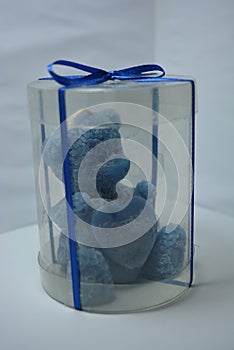 Beautiful and unusual candle in the form of an ivy blue bear located on a white background.