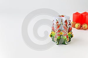 Beautiful unusual decorative candles on a white background, isolated. Christmas card, New Year decorations, balls