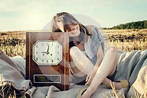 Beautiful unusual girl illustrates conceptual idea with watch