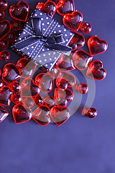 Beautiful valentines day background with red hearts on dark background.