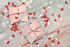 Beautiful valentines day gift box on marble background. romantic background greeting card, box, strips and hearts