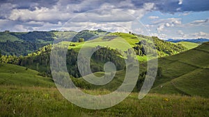 Beautiful valley in a rural region with some nice small forests on the side of the valley in Dumesti, Transylvania, Romania