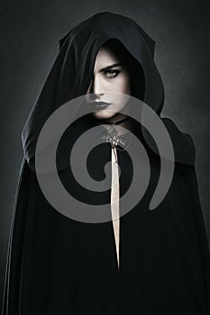 Beautiful vampire woman with black cloak