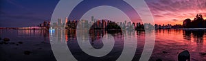 Beautiful Vancouver skyline and harbor with idyllic sunset glow, BC, Canada