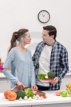 beautiful vegan couple cooking healthy