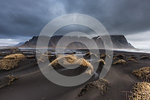 Beautiful Vesturhorn Mountain and black sand dunes in Iceland.