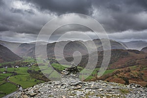 Beautiful vibrant Autumn landscape image towards Borrowdale Valley from Castle Crag in Lake District