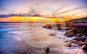 Beautiful, vibrant sunset in the sky in Kamay Botany Bay National Park, Australia